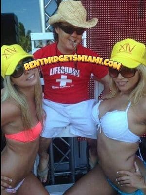 Little person entertainer dressed as a lifeguard character at a Miami beach-themed event